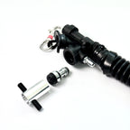 Aluminum K-style power inflator service tool with TPU-sleeved steel pin